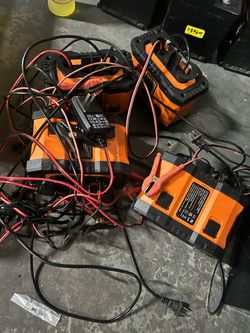 Lot of Orange Battery Chargers with Cables