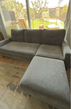 Charcoal grey couch sectional with ottoman