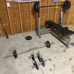 Bench press and weights for sale. Used but gets the job done.