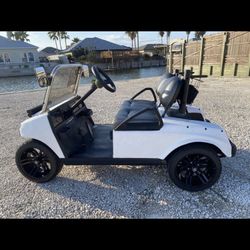 Club cart aluminum frame, black rims & tires, with Led head lights.
