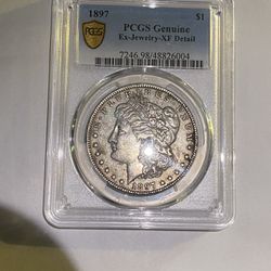 1897/PCGS genuine, extra fine detail, Morgan, silver Dollar with gold badge