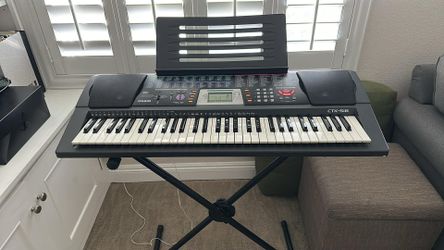 Casio CTK-518 keyboard, stand, adapter, and music stand,