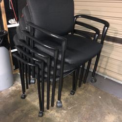 5 Black Stack Chairs And 4 Wood Stack Chairs 
