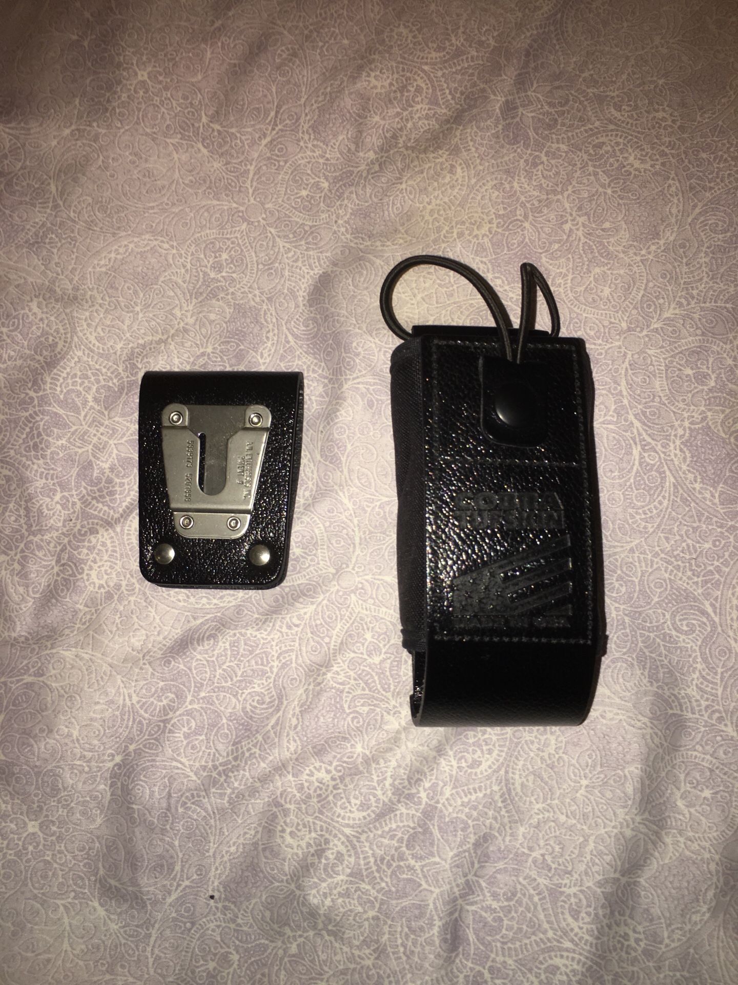 Cobra tuff skin police radio holder with belt clip.