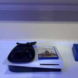 PS5 with PS5 Elite controller and ghost of yotei