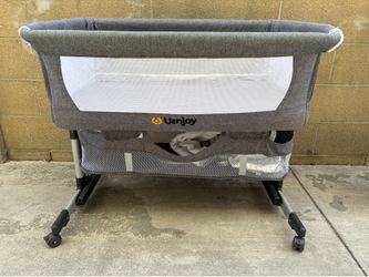 Used uenjoy baby bed side bassinet