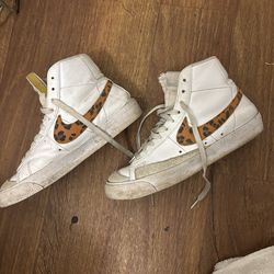 Nike shoes leopard print Nike logo