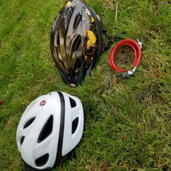 2 bike helmets and a chain