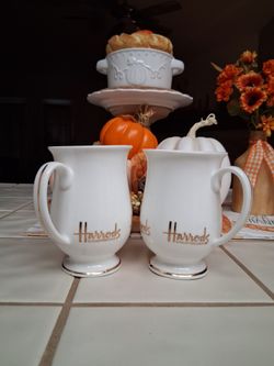 L😎😎K! TWO ~ HARRODS KNIGHTSBRIDGE footed coffee hot beverage MUG cup. PAIR ( x2 ) with Gold Trim Logo....asking $20.00
