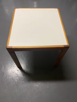 Wooden table with white top