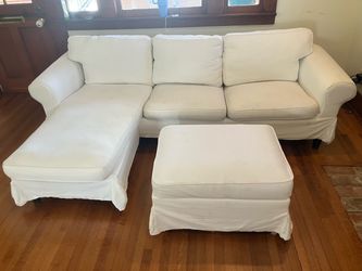 White Slipcovered Sectional Sofa with Ottoman