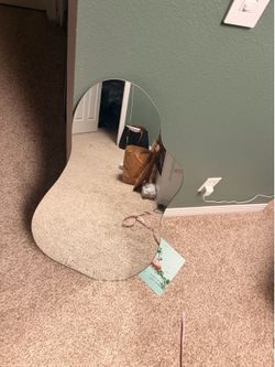 Irregular artsy mirror 19x35