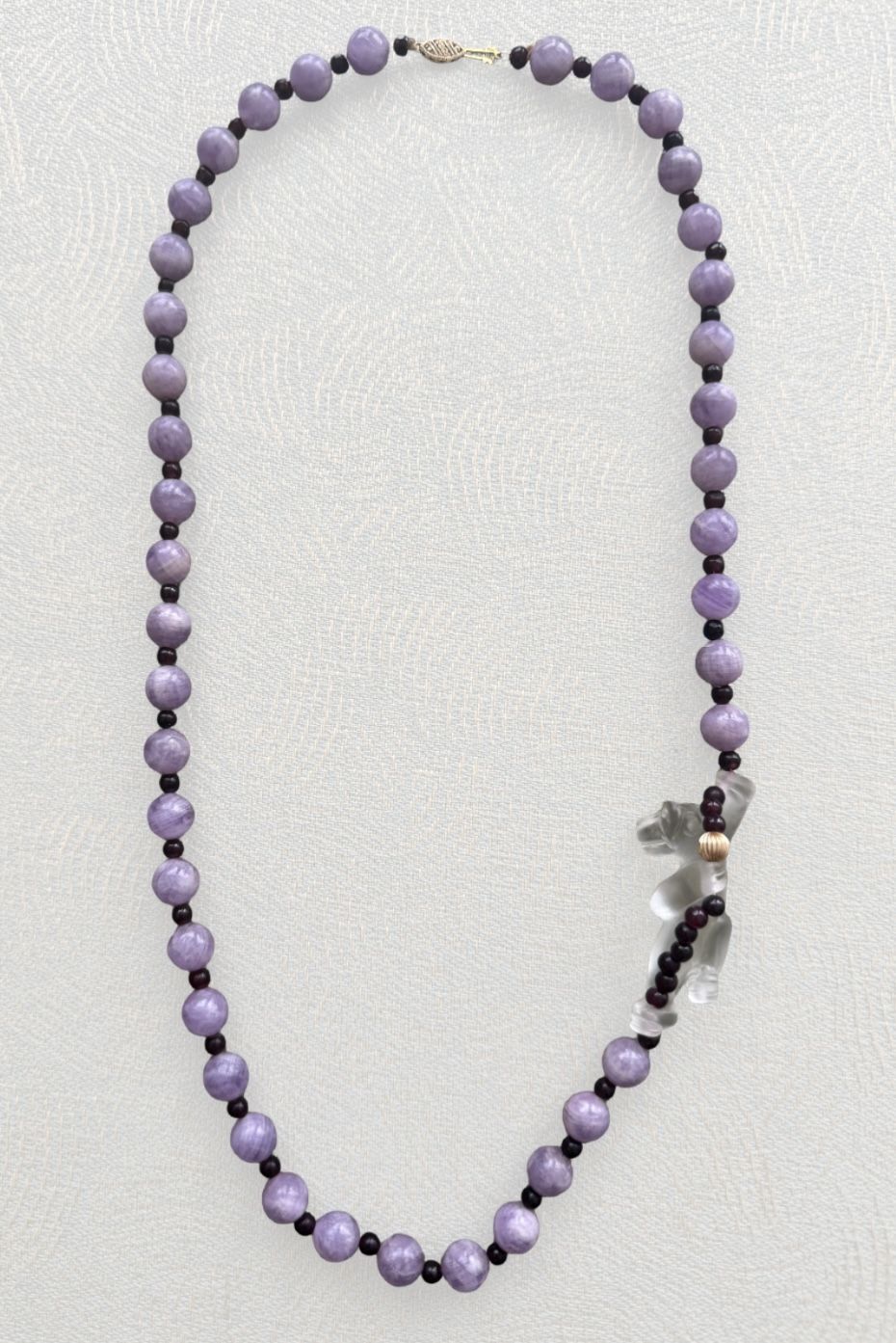 Vintage 14k Amethyst beaded necklace Gorgeous unique piece decorated with animal dog sculpture on the side  Approx 26” in length  In excel