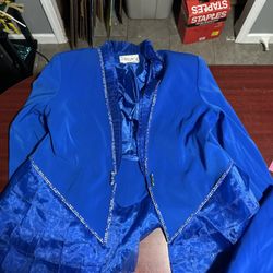 Elevate your style with this stunning Chrissimo jacket and shirt set in a beautiful royal blue shade. The set features a blouse with studded accents a