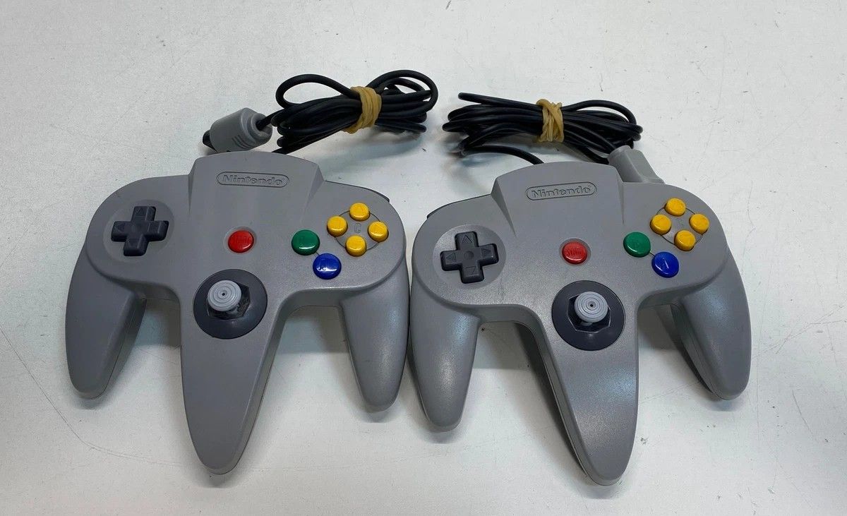 Pair of Solid Grey Nintendo N64 Controllers and Game