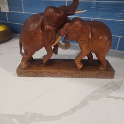 Elephants wood carved Orginal  look them up expensive Collectors only