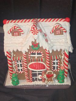 gingerbread house table piece, resembling festive holiday tabletop items