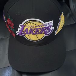 NewYork Yankees and La Lakers hats