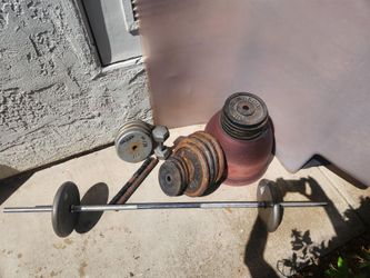 Assorted weights and barbel,l 250 + lbs