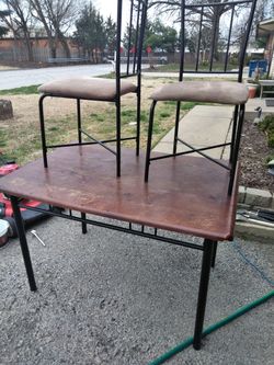 Wood table with three chairs