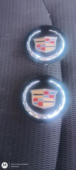 I Have 2 Cadillac Center Caps As Well As The Key Fob. 