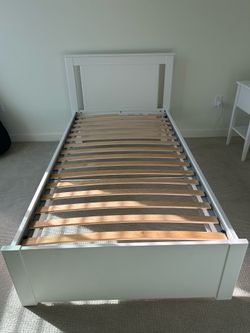 Twin size bed with slatted bed base from IKEA