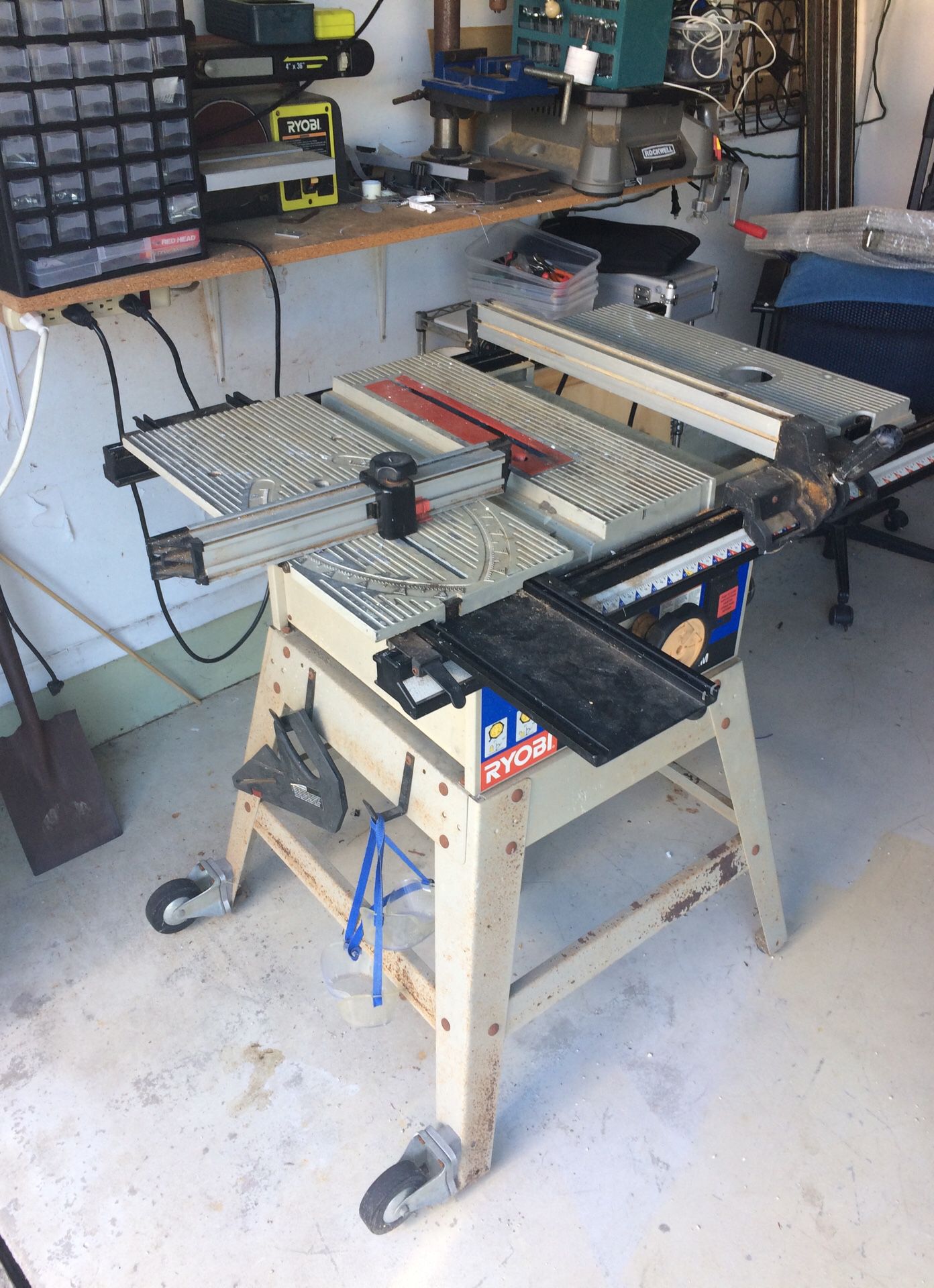 Ryobi 10 “ Table Saw. BT3100. With solid metal stand and wheels. This is the all metal model. Not plastic like the newer ones. Good, solid saw with r