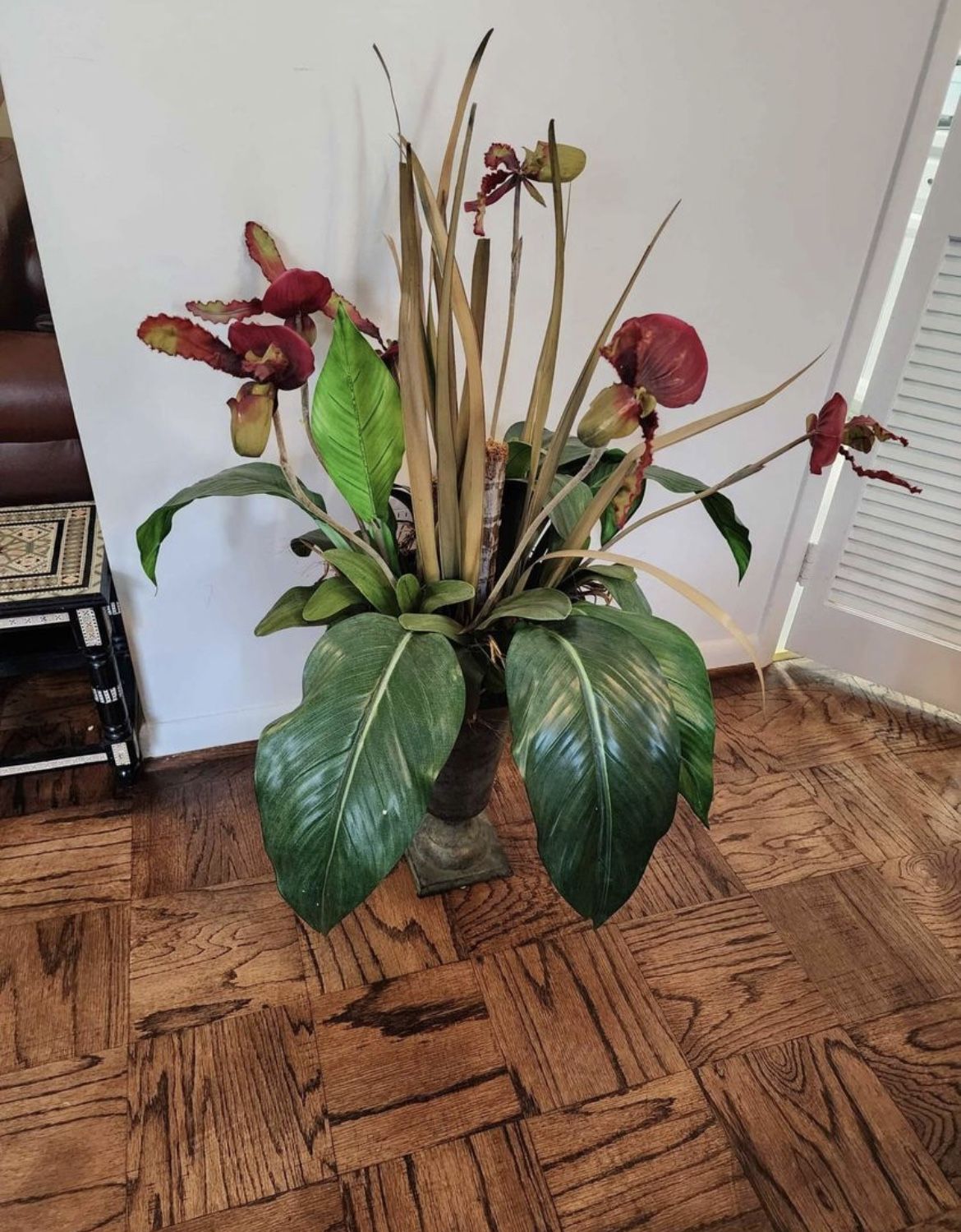 Brand new artificial flower plant in Lady Slipper Vase. Retails for $800.