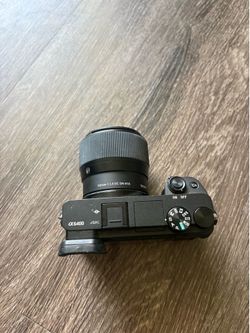 Sony A6400 body + 56mm sigma lens