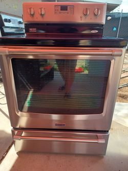 STOVE  Maytag ELECTRIC STEEL STAINLESS EVERTING WORKING VERY CLEANING DELIVERY AND INSTALLATION AVAILABLE