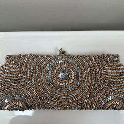 Beautiful WHITE HOUSE BLACK MARKET clutch with silver and neutral beading detail