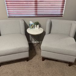 2 matching grey chairs