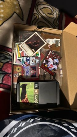 Box filled with Basketball and football cards