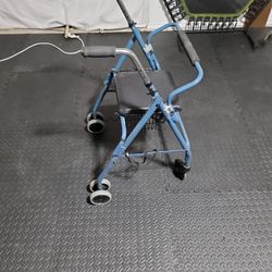 Beautiful light blue Walker with shock absorbers, chair, and Storage compartment.