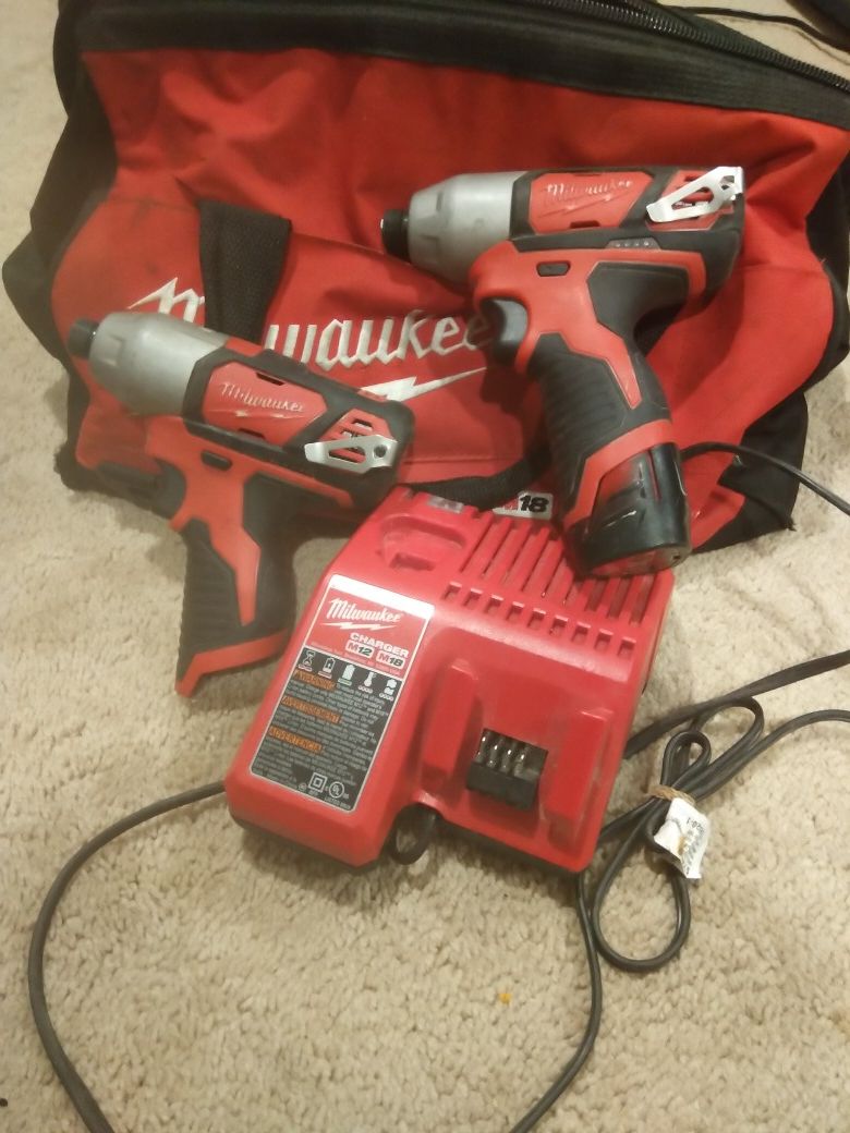 Two impact drilles 12 volt Milwaukee and battery..