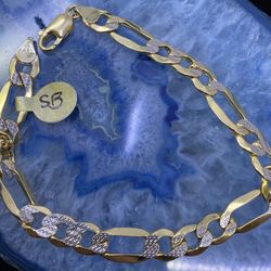 $1300 Two Tone Gold Figaro Bracelet