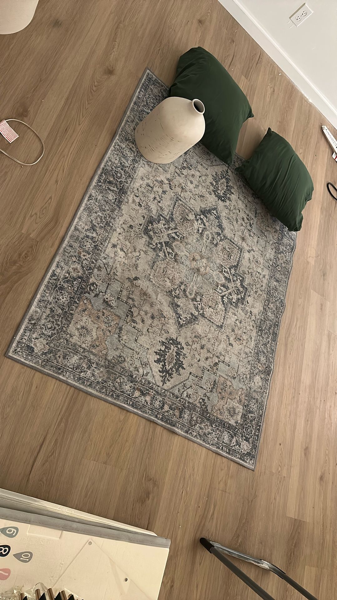 rug, vase and two pillows