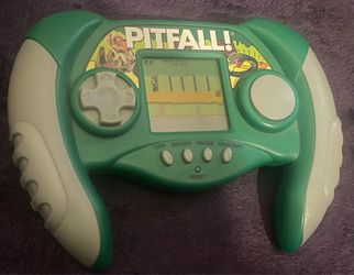 Excalibur Electronics PITFALL! Model 482 Handheld LCD Game – Vintage Price: $10 Description: Vintage Excalibur Electronics PITFALL! Model 482 handhe