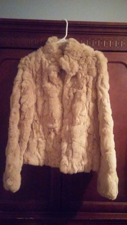 Woman's waist length fur coat