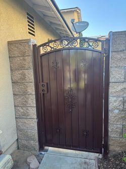 Wrought Iron Side Gate with Decorative Scrollwork