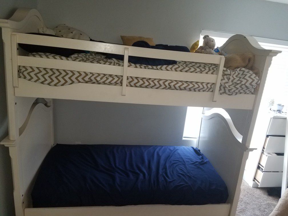Twin bunk beds, solid wood, good condition, sturdy. Ladder needs bracket. $600.00 OBO Originally purchased from Mor furniture