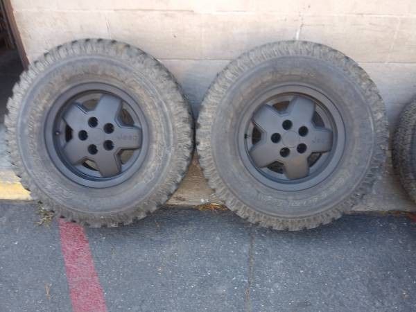 Two black alloy rims and 31 inch tires 5 lug Dodge, Ford, Jeep, Toyota