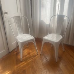 Two White Metal Chairs 