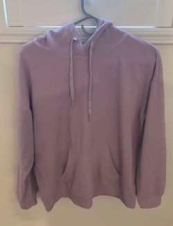 Stylish slate blue crew neck sweatshirt has long sleeves and a kangaroo pocket.