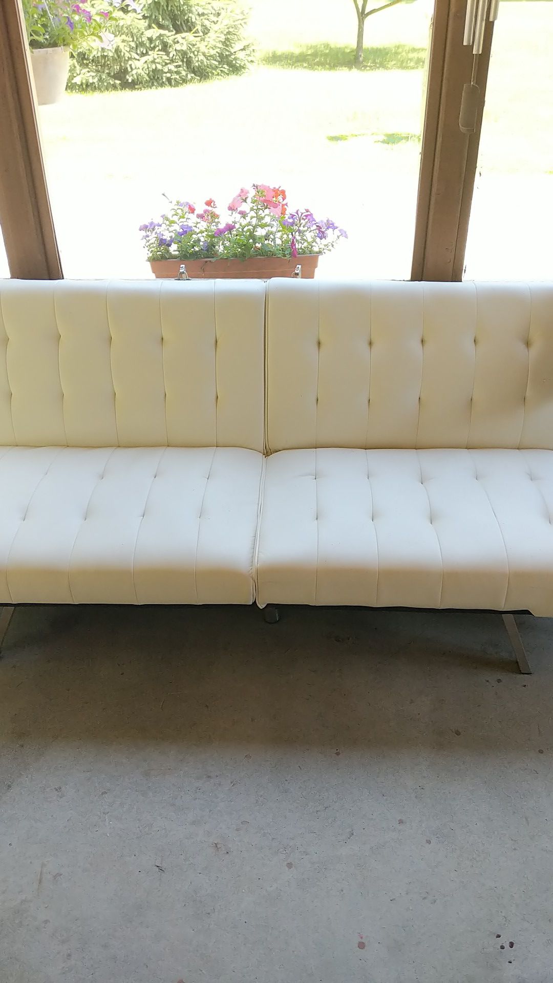 White leather futon - works just fine, cat scratches