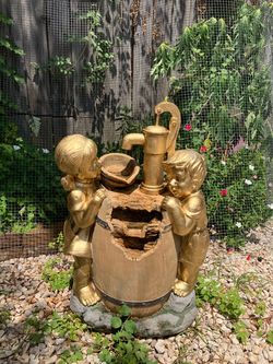gold girl and boy fountain