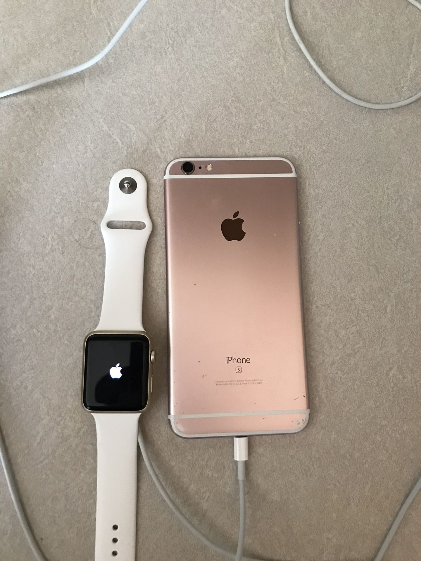iPhone 6s Plus rose gold and an Apple Watch series 1