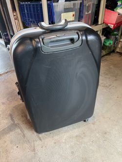Samsonite large 4 wheel luggage with locks. Very nice and clean!.
