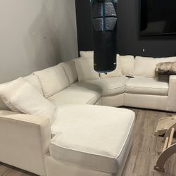 White Sectional With Rolling Storage Ottoman 