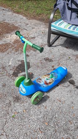 Dinosaur scooter push the button and it goes has a little Electric battery charger with it